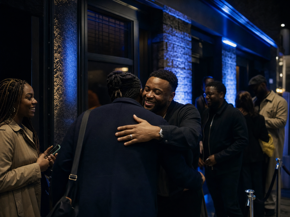 Hosts welcoming guests at the door