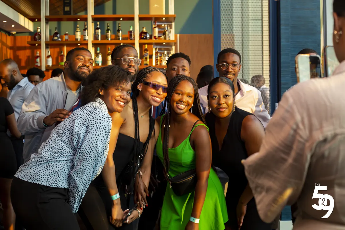 Guests posing together at the bar during The529